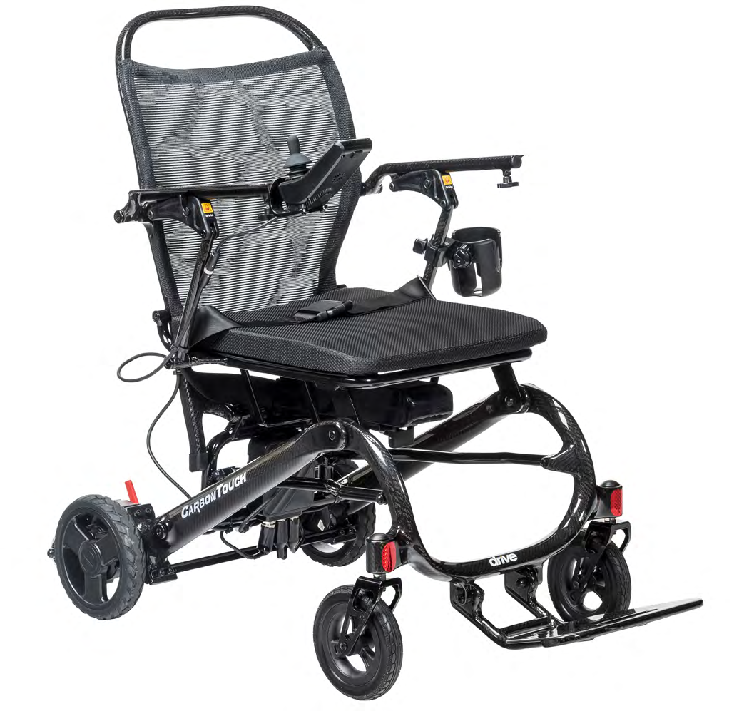 Black folding power wheelchair with joystick control and footplate.