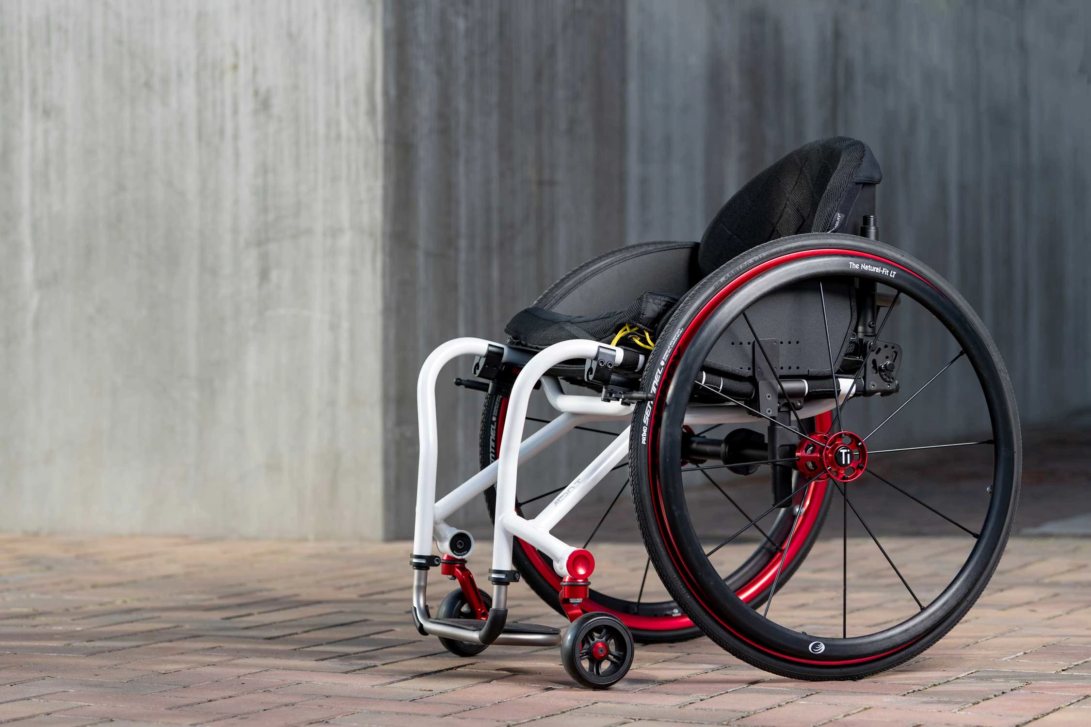 TiLite Aero T manual wheelchair with white frame and red accents