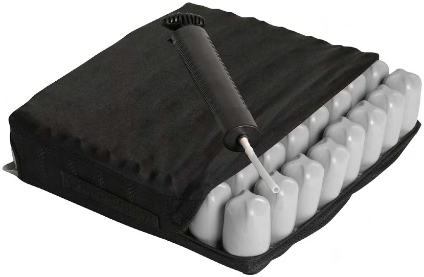 Wheelchair air-cell seat cushion with a black cover partly open and a hand pump resting on top.